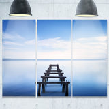 jetty remains in blue lake seascape photo canvas print PT8366