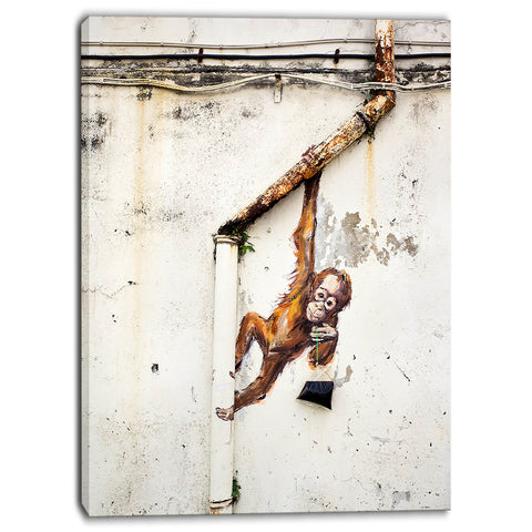 baby orangutan hanging from pipe street art canvas print PT6969