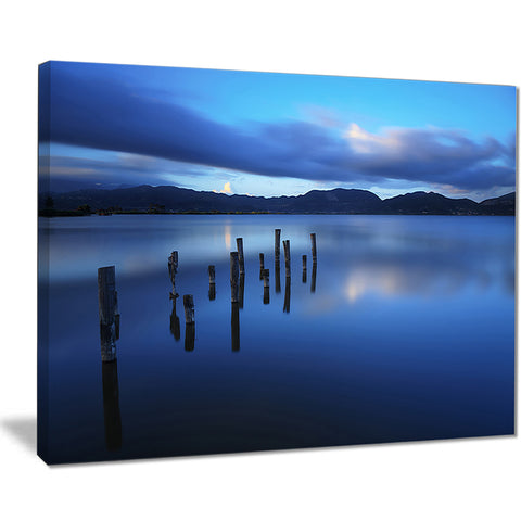 dark blue sea with pier remains seascape photo canvas print PT8367